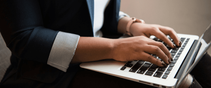 Person typing on a keyboard